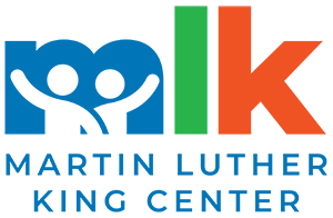 Letters M L and K with outlines of two people inside the m above text that says Martin Luther King Center